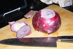 slicing a red onion