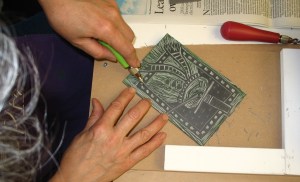 carving snowman in lino block