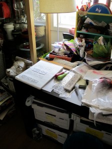 crowded corner of work table in the annex