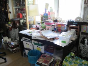 crowded work table in the studio annex