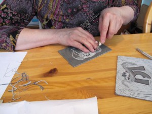 my hands carving lino plate my hands carving