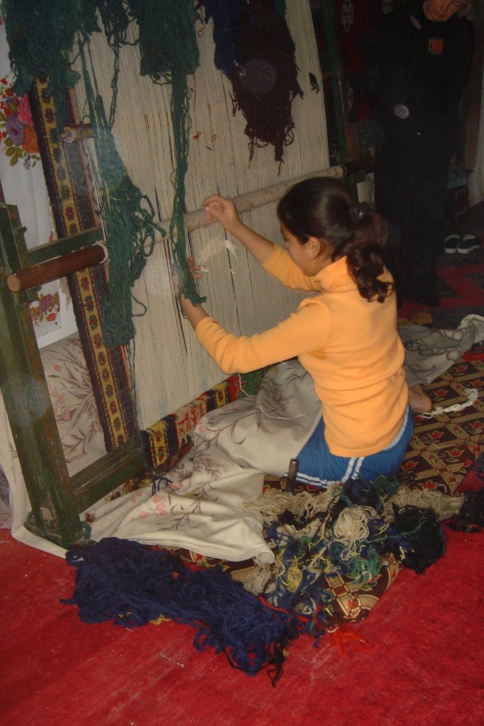 young girl weaving
