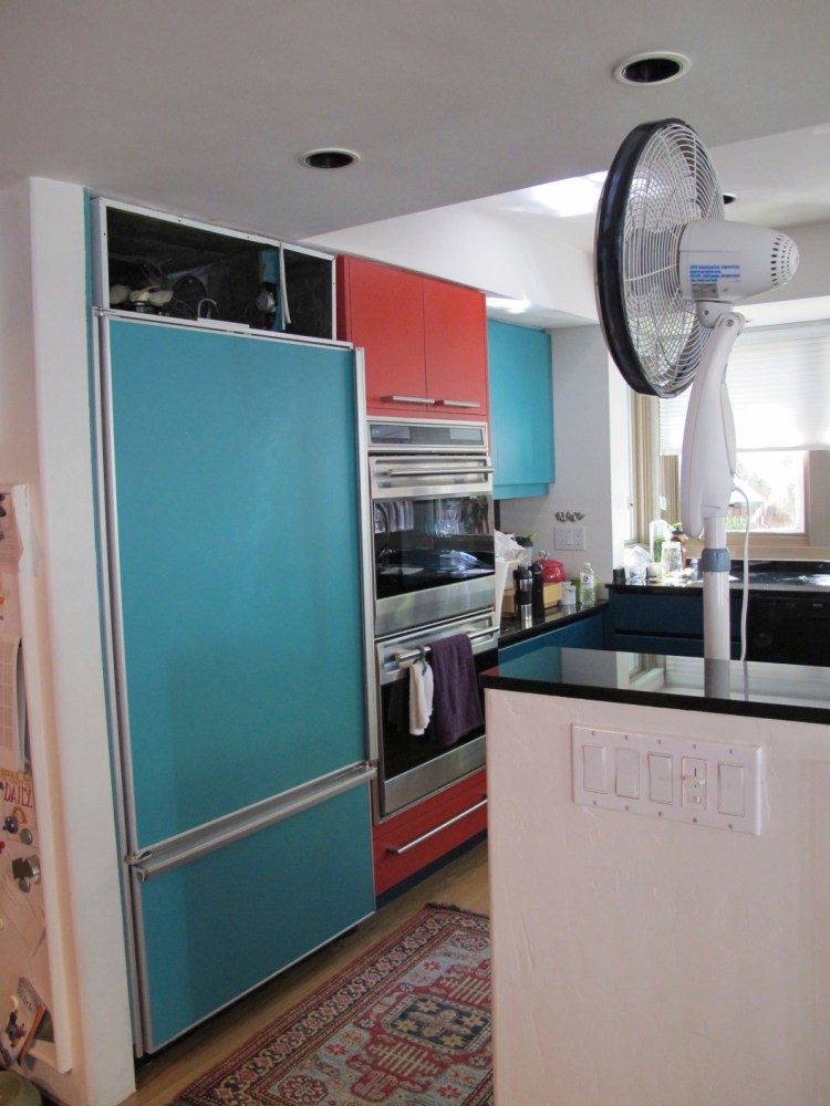 fan blowing into fridge compartment