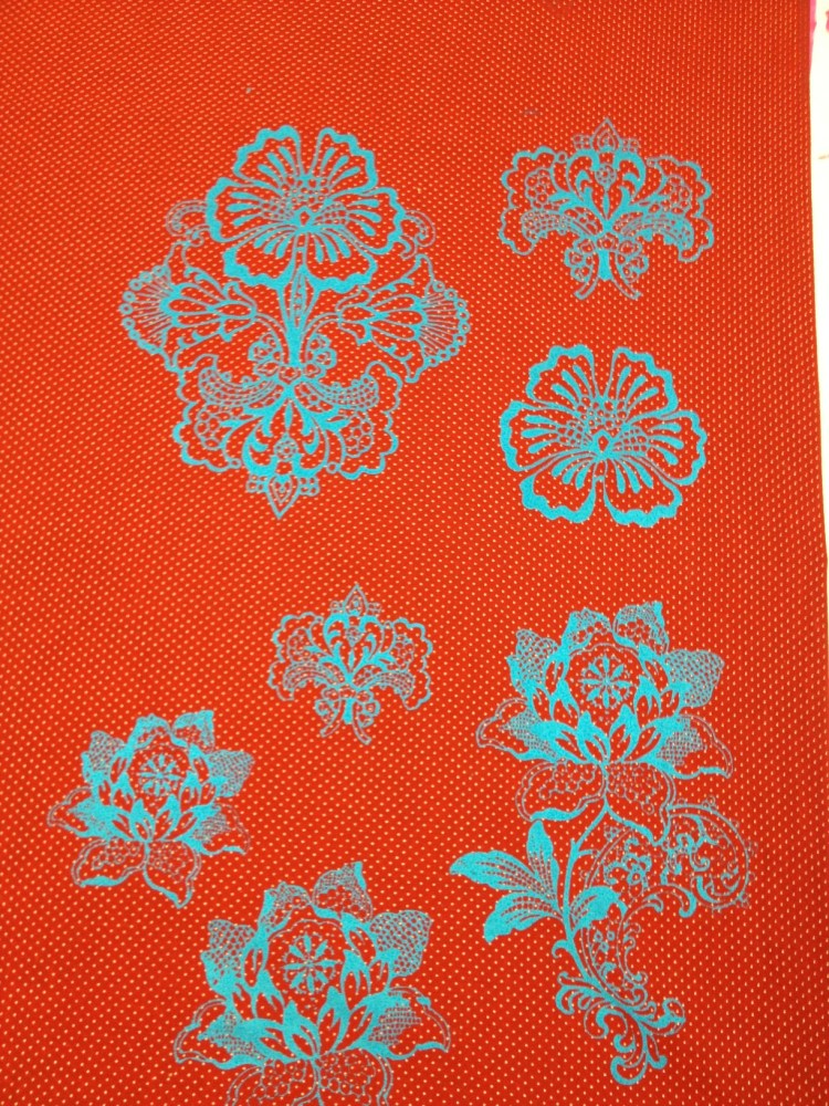 blue print on red fabric
