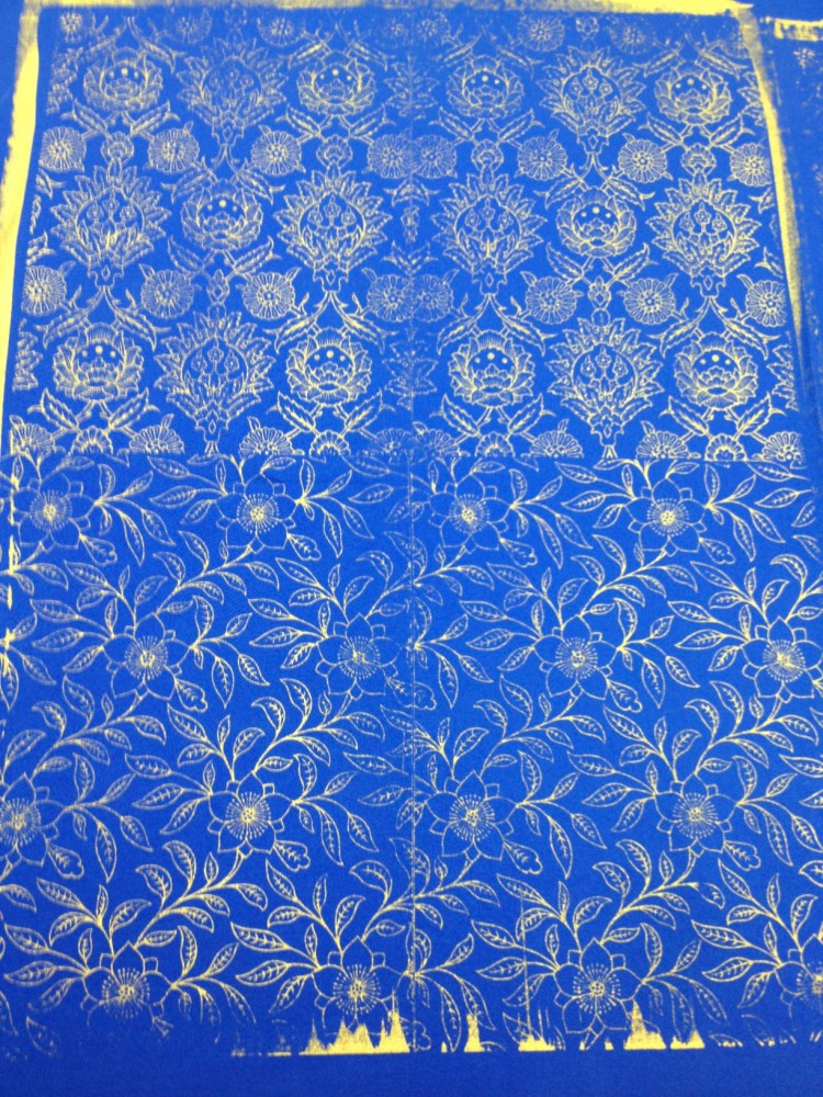 gold ink on blue fabric