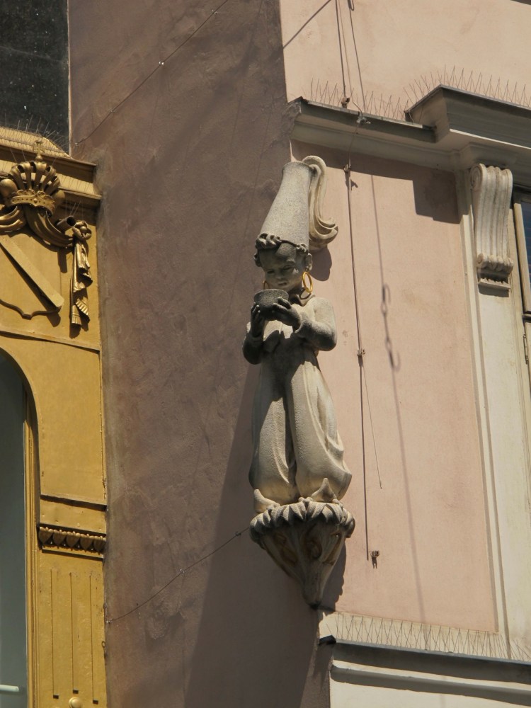small sculpture on building
