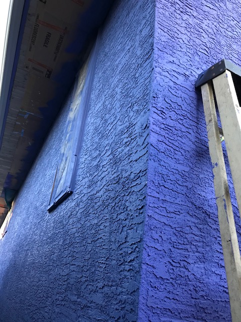 blue stucco house corner